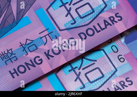 Dettaglio macro delle banconote in dollari di Hong Kong. Concetto di denaro mondiale, concetto di inflazione ed economia. Traduzione: Dieci dollari di Hong Kong Foto Stock