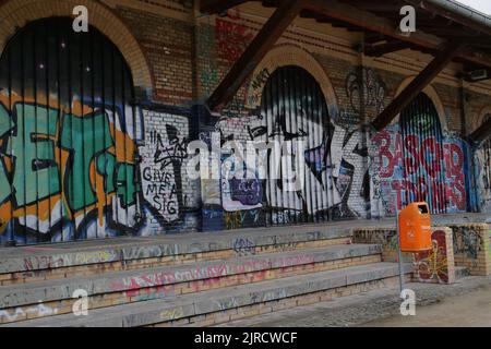 An old train station with graffiti on the walls in Goerlitzer Park in Berlin, Germany Stock Photo