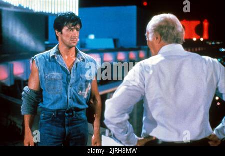 SYLVESTER STALLONE, ROBERT LOGGIA, sopra la parte superiore, 1987 Foto Stock