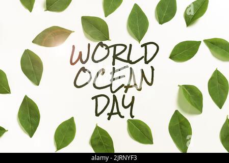 Ispirazione che mostra il segno World Ocean Day. Concetto che significa celebrazione mondiale per i grandi corpi di uomo d'affari di acqua salata con penna che punta sulle frecce Foto Stock