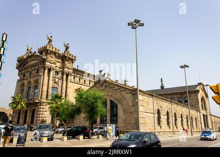 A beautiful shot of the Port Authority building in Barcelona, Spain against palm trees Stock Photo