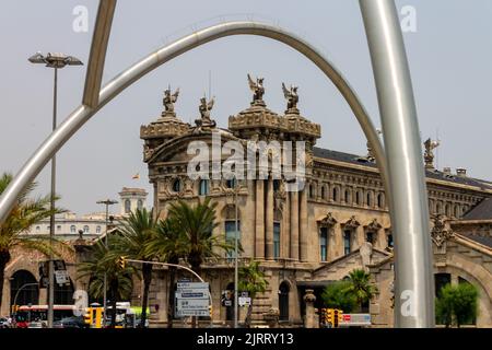 A beautiful shot of the Port Authority building in Barcelona, Spain against palm trees Stock Photo