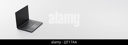 Computer portatile su sfondo grigio con spazio di copia Foto Stock
