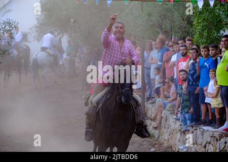 La Carrera de Cintas a Caballo annuale durante la Feria estiva di Comares Pueblo, Axarquia, Malaga, Andalusia, Spagna Foto Stock
