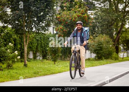 consegna di cibo uomo con borsa in bicicletta Foto Stock