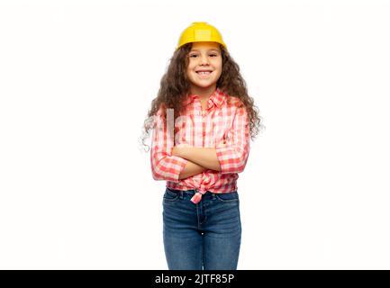 bambina sorridente in casco da costruzione Foto Stock