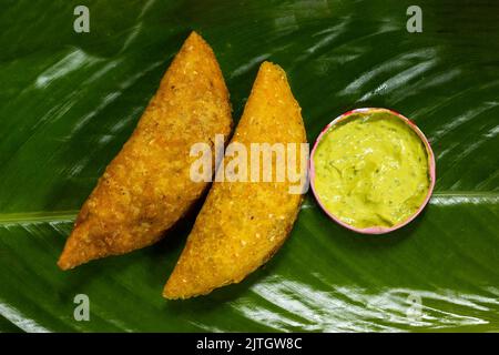 deliziosa empanada fatta di mais e farcita con carne e patate Foto Stock