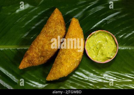 deliziosa empanada fatta di mais e farcita con carne e patate Foto Stock