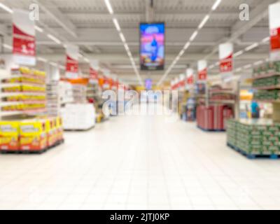 Astratto sfocato navate supermercato per sfondo. - foto di scorta Foto Stock