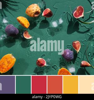 Tavolozza di colori da immagine di frutti esotici in acqua spruzzata. Fico viola, pere di fico giallo e arancio, frutti sani di cactus su g smeraldo Foto Stock