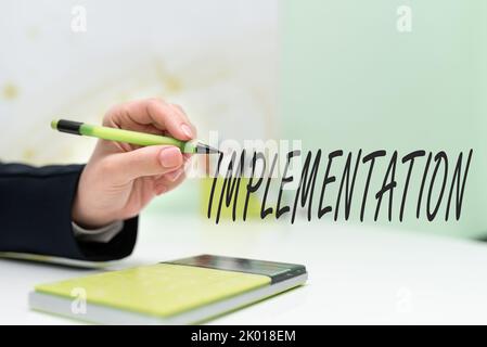 Didascalia di testo Presentazione ImplementazioneIl processo di rendere qualcosa di attivo o efficace. Business vetrina il processo di rendere qualcosa di attivo o. Foto Stock