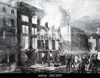 I membri della London Fire Brigade combattono un incendio in un laboratorio di costruttori di pullman a Oxford Street vicino a Hannover Square. Foto Stock
