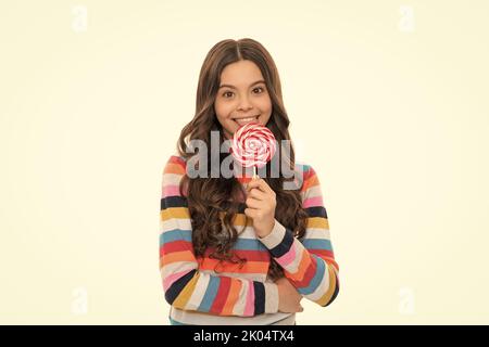 infanzia sana. cura dentale teen. dente dolce. yummy. ragazza felice tenere lollipop Foto Stock