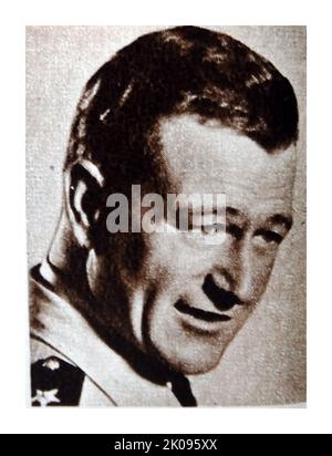 John Wayne. Marion Robert Morrison (26 maggio 1907 - 11 giugno 1979), conosciuto professionalmente come John Wayne e soprannominato Duke, è stato un attore e regista americano che è diventato un'icona popolare attraverso i suoi ruoli protagonisti in film realizzati durante la Golden Age di Hollywood, specialmente in film occidentali e di guerra. Foto Stock