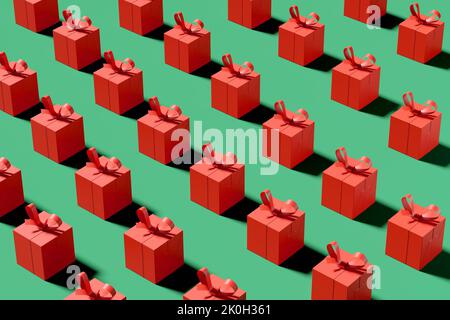 Motivo senza cuciture di scatole regalo rosse su sfondo verde. Celebrazione di Natale, shopping e presente concetto. Rendering 3D. Foto Stock