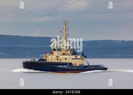 Tug Svitzer Avon in partenza per incontrare l'Asso Sanderling Foto Stock