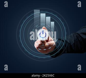 la mano di un uomo d'affari preme il pulsante di accensione virtuale. Apertura delle imprese e nuovi mercati di vendita, l'inizio di una nuova vita. Avanti ai risultati Foto Stock
