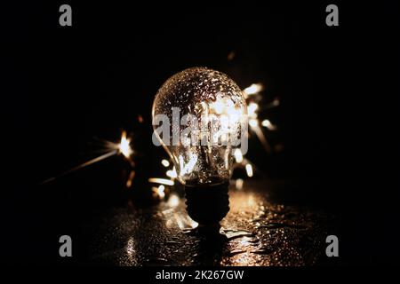 Light bulb with sparks Stock Photo