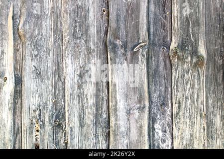 Sfondo di tessitura di legno. Primo piano di una vecchia tavola di frammenti di legno con una superficie resistente agli agenti atmosferici. Foto Stock