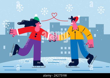 Una coppia felice si diverti sulla pista di pattinaggio Foto Stock
