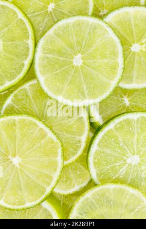 Limes agrumi lime raccolta cibo sfondo ritratto formato frutta fresca Foto Stock
