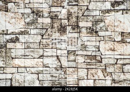 La texture della loro pietra stratificata sul recinto. Tessitura di pietra. Foto Stock