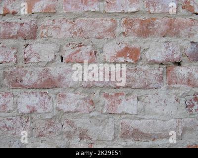 Muratura in mattoni liberata da intonaco, casa senza intonaco muro di mattoni senza parete intonacatura Foto Stock