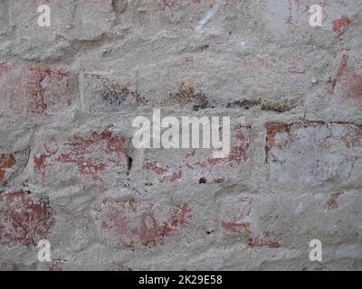 Muratura in mattoni liberata da intonaco, casa senza intonaco muro di mattoni senza parete intonacatura Foto Stock