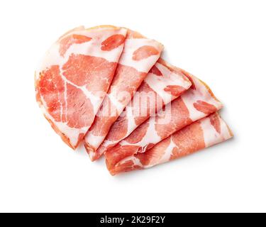 Prosciutto italiano secco. Coppa Stagionata isolata su sfondo bianco. Foto Stock