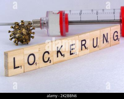 Covid-19 easing messo come un tema con le lettere Foto Stock