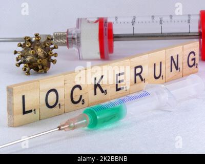 Covid-19 easing messo come un tema con le lettere Foto Stock