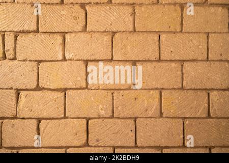muro costruito di blocchi di pietra di tufo Foto Stock