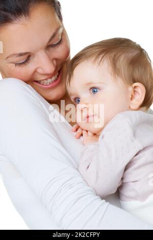 Ceneri la mia ragazza speciale. Una donna attraente che tiene il suo bambino piccolo. Foto Stock