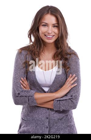 Casual e di classe. Studio ritratto di una bella giovane donna isolato su bianco. Foto Stock