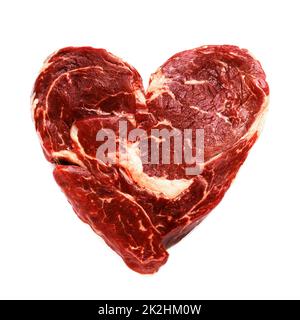 Carne di manzo cruda fresca a forma di cuore Foto Stock