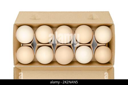 Uova di pollo fresche, uova di gallina crude, in un contenitore di cartone, dall'alto Foto Stock