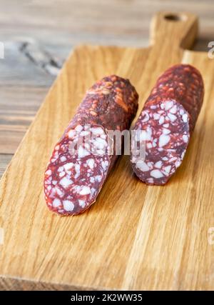 Salsiccia di Braunschweiger sul tagliere wodden Foto Stock