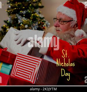 Composizione del testo del giorno di san nicola su babbo natale con regali Foto Stock