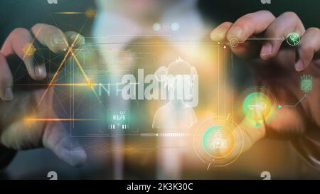 Mani maschili che tengono un dispositivo futuristico con infografiche NFT Foto Stock