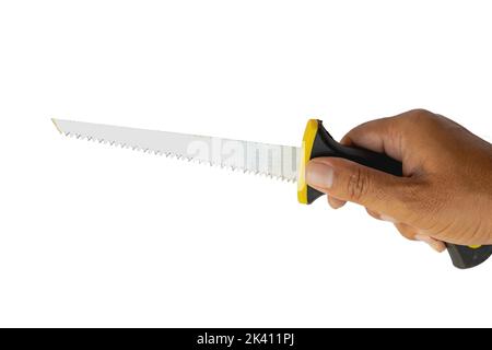 Piccola sega a mano che tiene in mano su sfondo bianco isolato Foto Stock