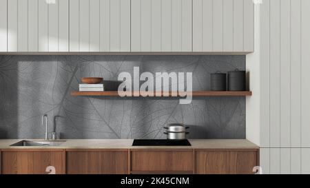 Primo piano della cucina in legno giapponese nei toni del bianco e del grigio. Armadietti moderni, carta da parati, scaffale con decorazioni e piano cottura a induzione. Interni dal design minimalista Foto Stock