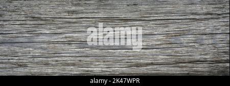 Legno fondo stalla, vecchio asse di legno ruvido, vista dall'alto. Legno sporco intaccato con crepe e granella. Legno grigio rustico vintage. Modello, textur Foto Stock