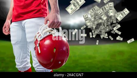 Composizione delle banconote americane in dollari sulla metà del calcio americano. Concetto di business, sport e competizione generato digitalmente imag Foto Stock