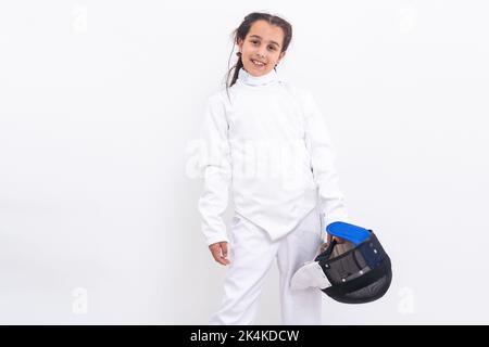 bambina in un vestito di scherma Foto Stock