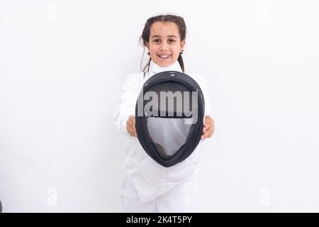 bambina in un vestito di scherma Foto Stock