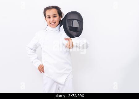 bambina in un vestito di scherma Foto Stock