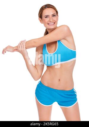 Riscaldamento per la gara - Fitness Health. Una giovane donna in forma che fa allunga mentre isolata su uno sfondo bianco. Foto Stock