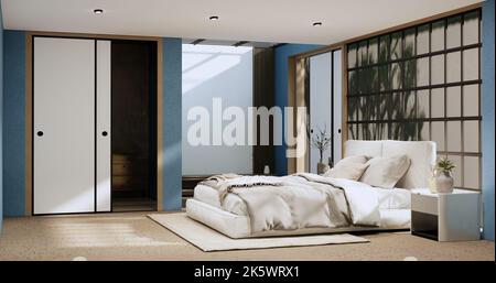 Wabi sabi letto e piante di deciartion in camera da letto giapponese blu. Rendering 3D. Foto Stock