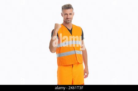 operaio di successo in uniforme arancione. lavoratore uomo che indossa giubbotto riflettente da lavoro. Foto Stock