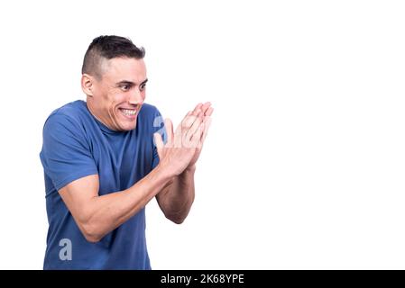 L'uomo strofinando le mani con espressione soddisfatta Foto Stock